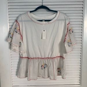 New with tags adorable white t shirt Size small but runs large.